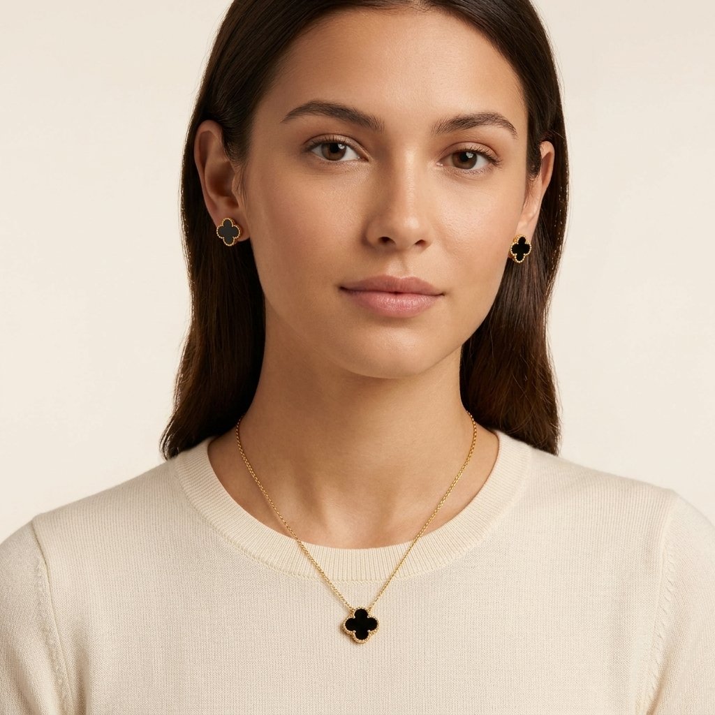 Model wearing MMHashmi gold clover jewelry